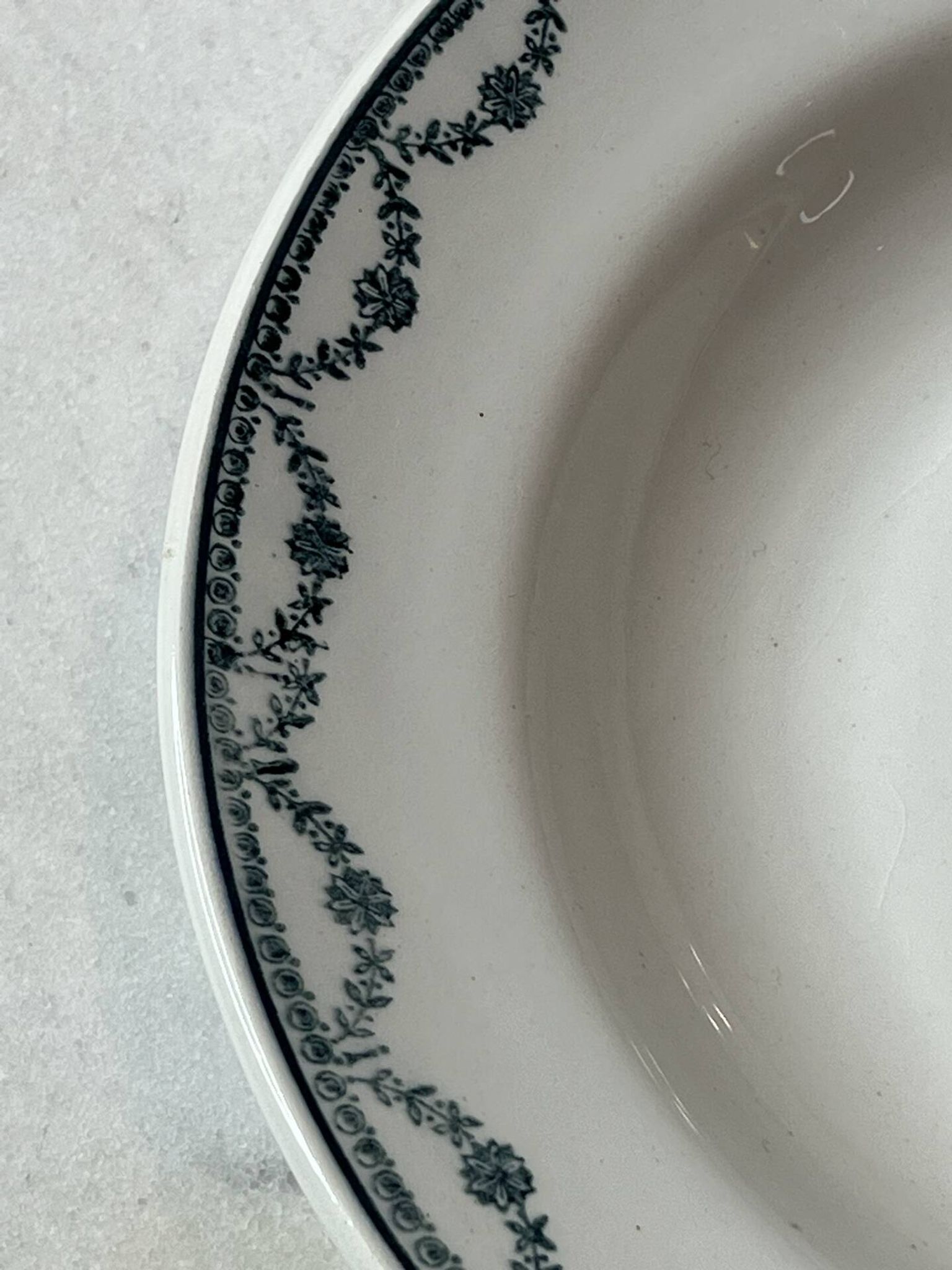 Set of 12 deep plates Saint Amand with floral garland decoration.