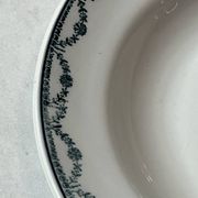 Set of 12 deep plates Saint Amand with floral garland decoration.