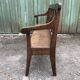 Duo of old solid oak benches with backs and armrests.