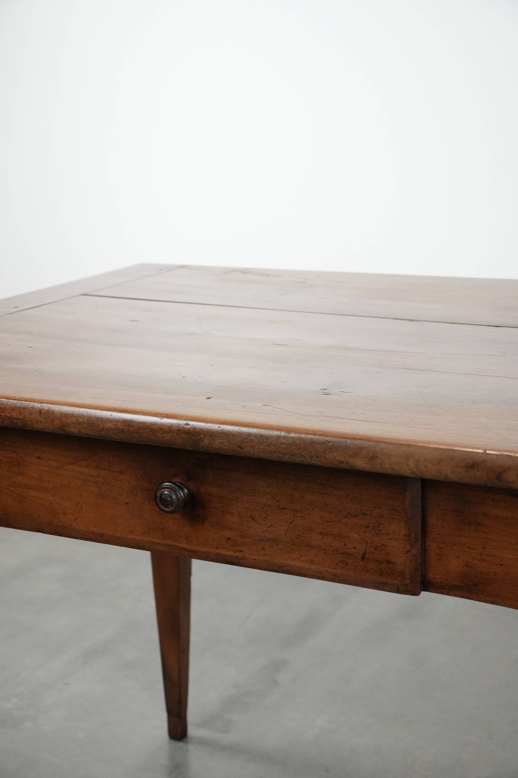 Elegant and subtle antique French dining table made of fruitwood