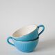 Pair of digoin sarreguemines cups textured sky blue and gold edging 1950