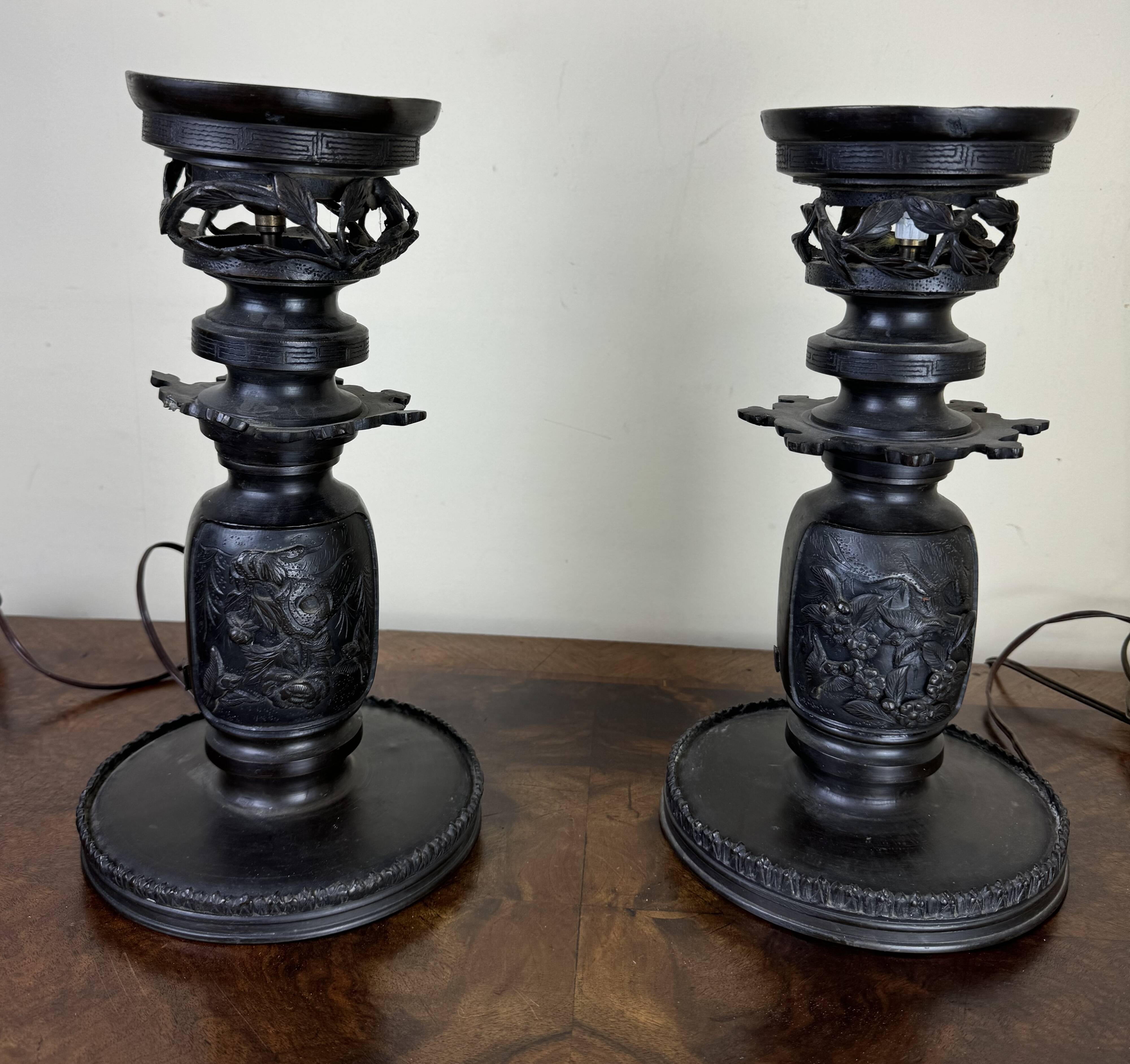 Japan Meiji period: Pair of patinated bronze candlesticks circa 1880