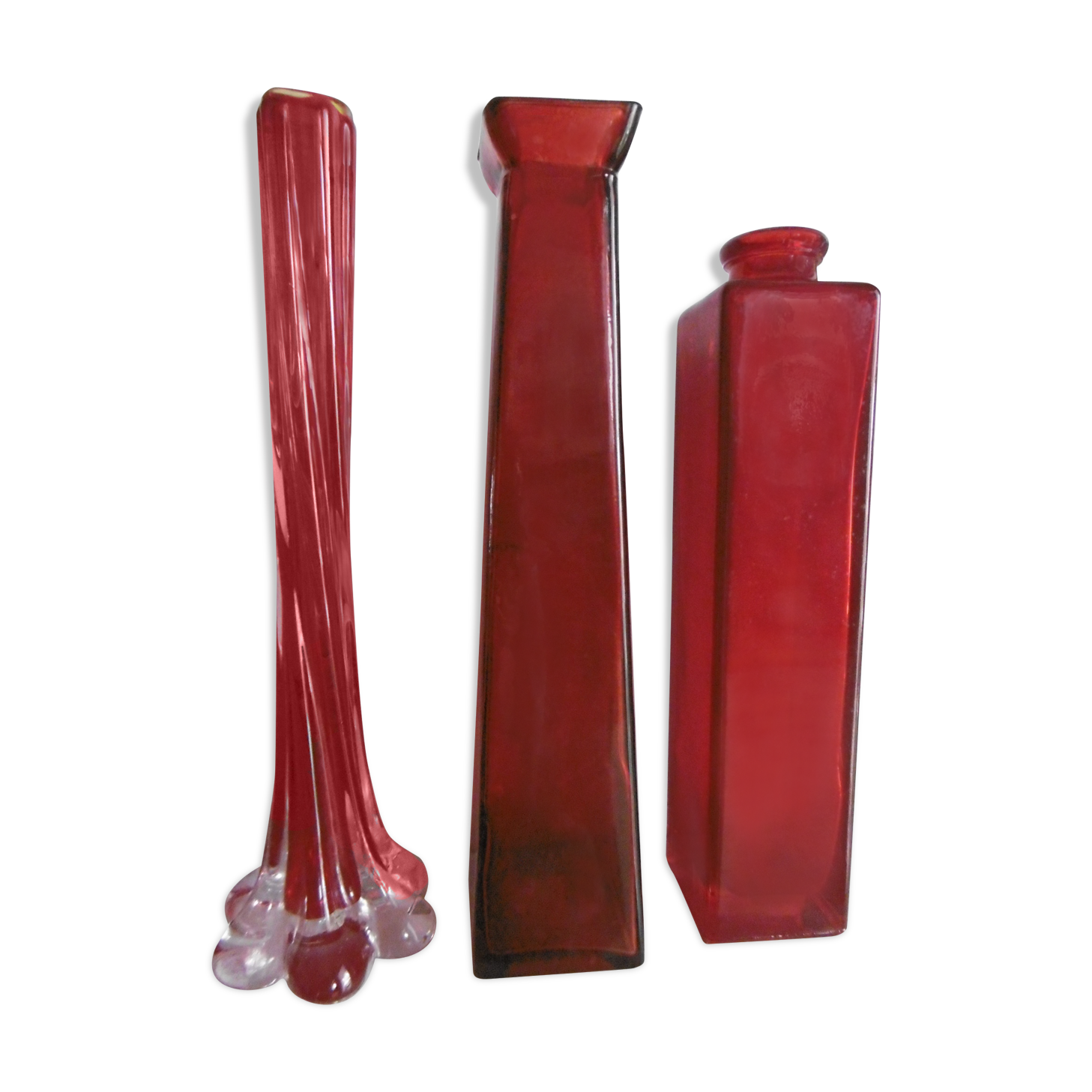 Set of three red bottles