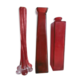 Set of three red bottles