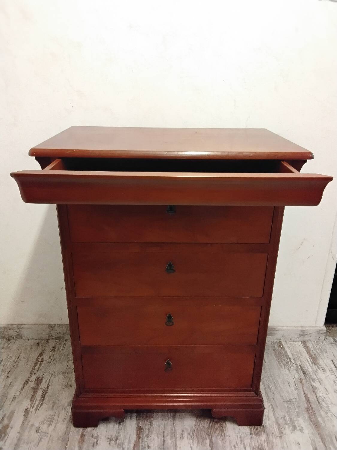 Wooden chest of drawers with a secret drawer