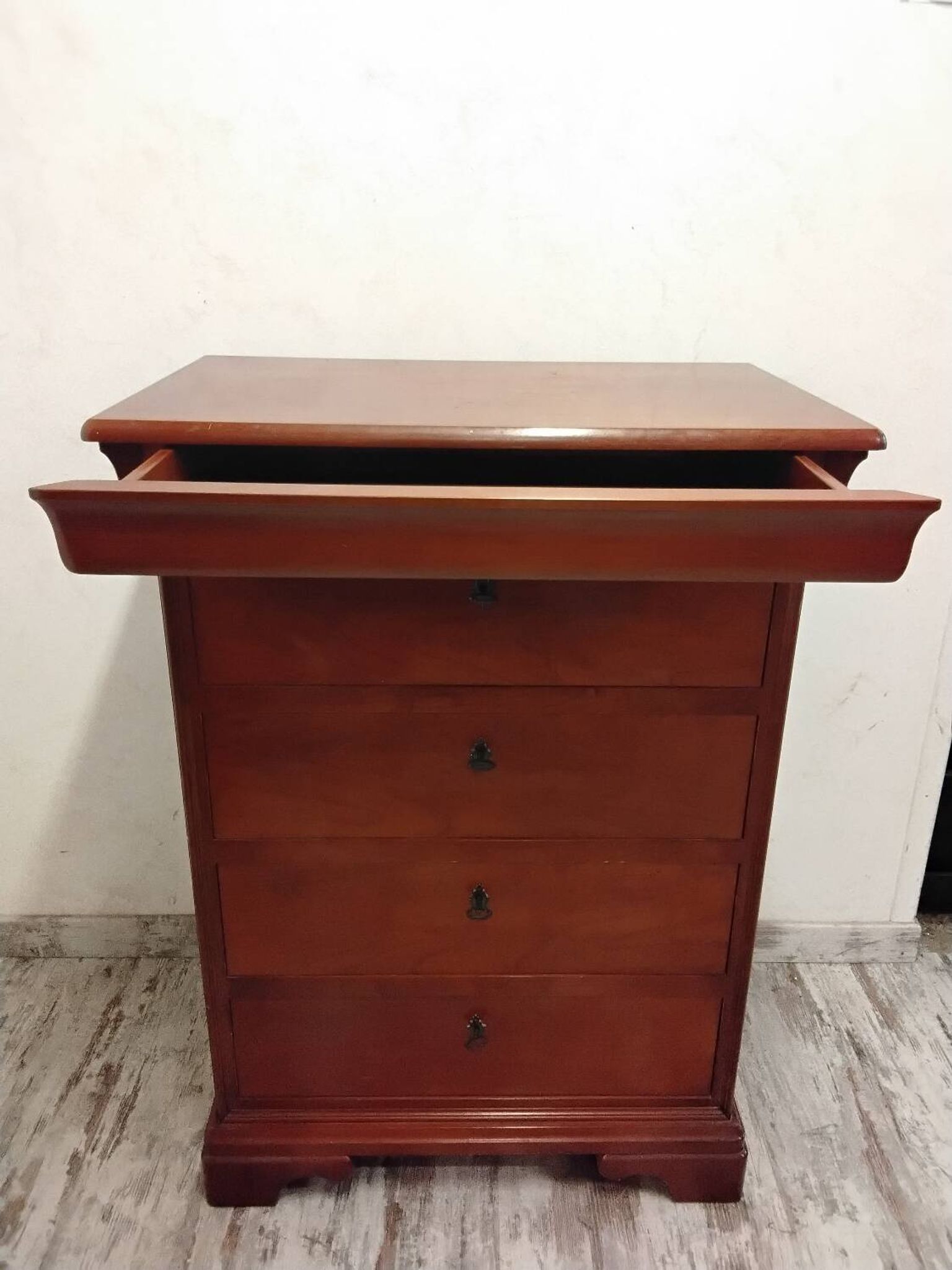 Wooden chest of drawers with a secret drawer