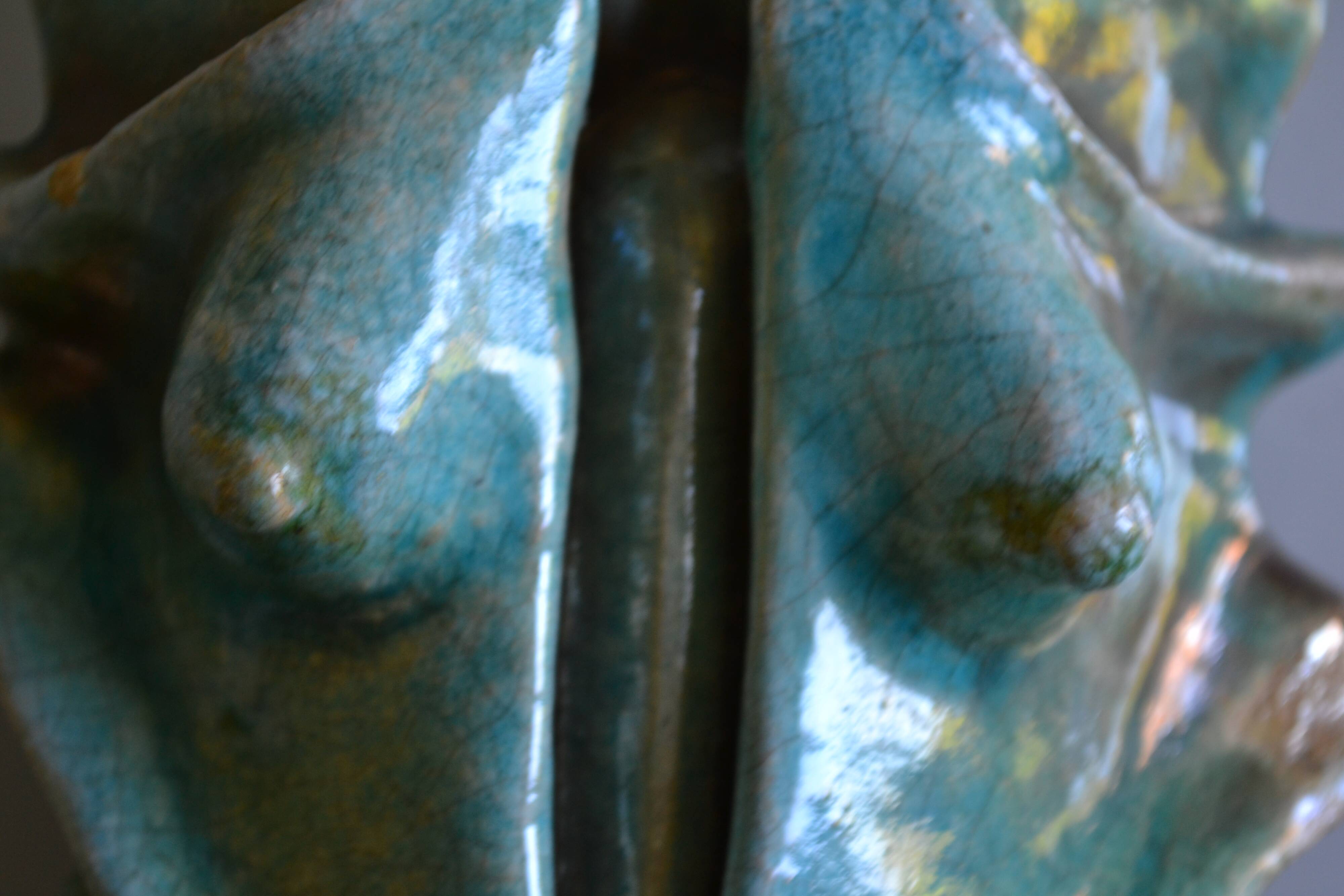 Surreal ceramic sculpture in relief signed to be identified.
