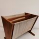Magazine rack in teak wood with sand-coloured canvas, Danish and from the 1970s.