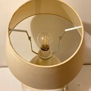 1980s ceramic table lamp with a wooden base and adjustable shade.