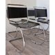 Series of 6 minimalist chairs in chrome metal and black leather around 1970