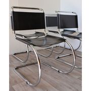 Series of 6 minimalist chairs in chrome metal and black leather around 1970