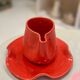 Set of ceramic artisan mugs with poppy red water lily design.