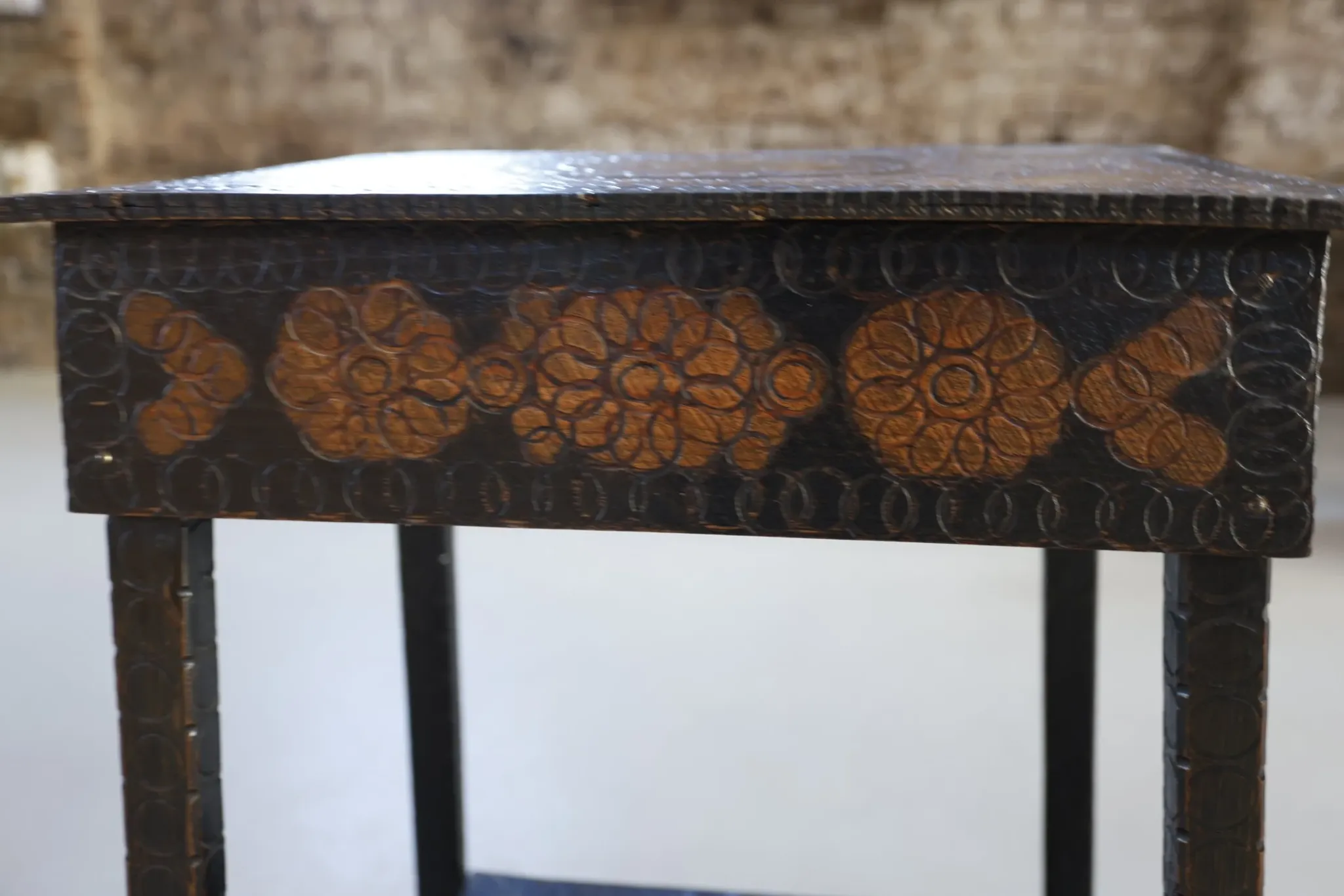 Decorated antique side table with elephant