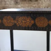 Decorated antique side table with elephant