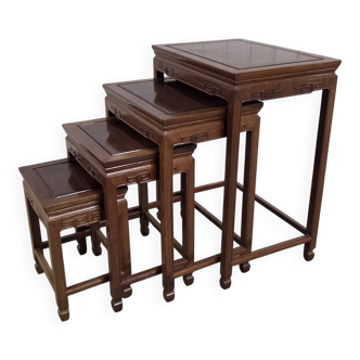 Set of nesting tables in rosewood.