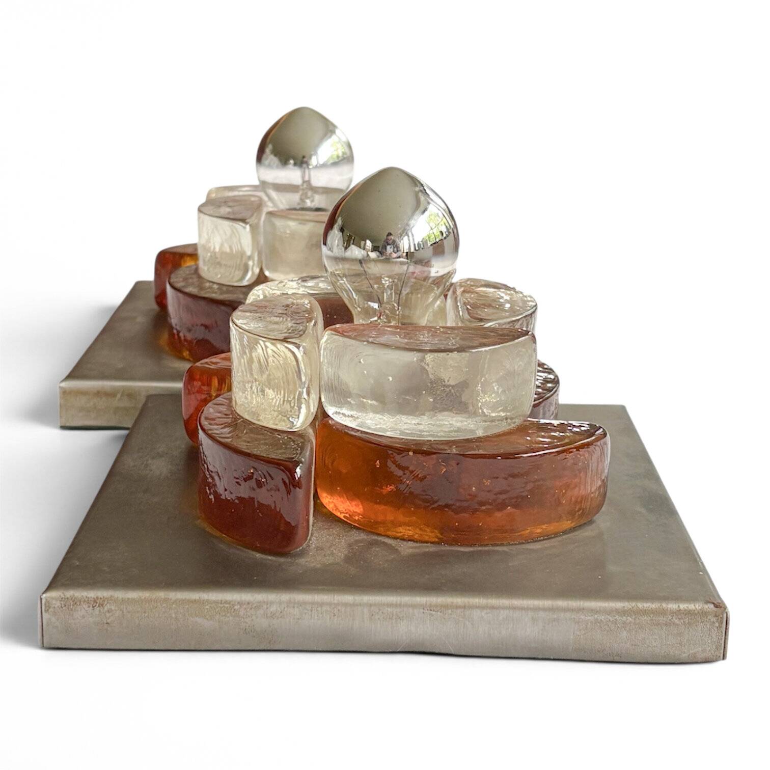 Pair of sculptural wall lights in moulded glass and metal
