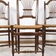 3 wooden and straw chairs, decorated with a sheaf of wheat.