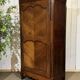 Louis XV bonnetière in cherry wood, early 19th century.