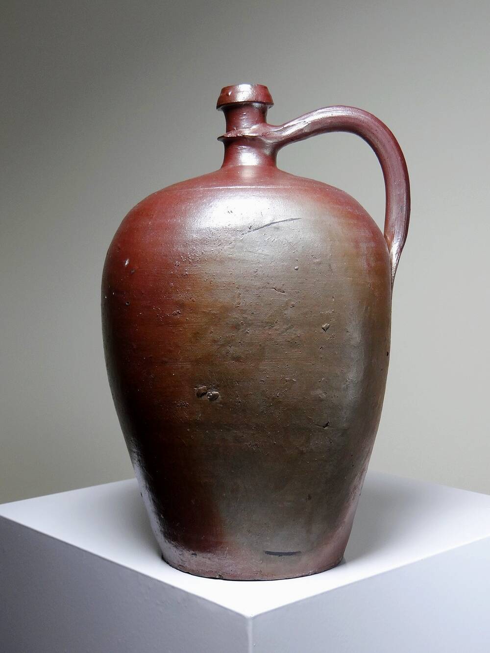 Large stoneware jar from Normandy with lustrous burgundy glaze, from the 1920s-30s.