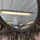 Miroir en bronze à volutes style rocaille