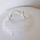 White porcelain soup tureen from Limoges with a vegetal scroll design.