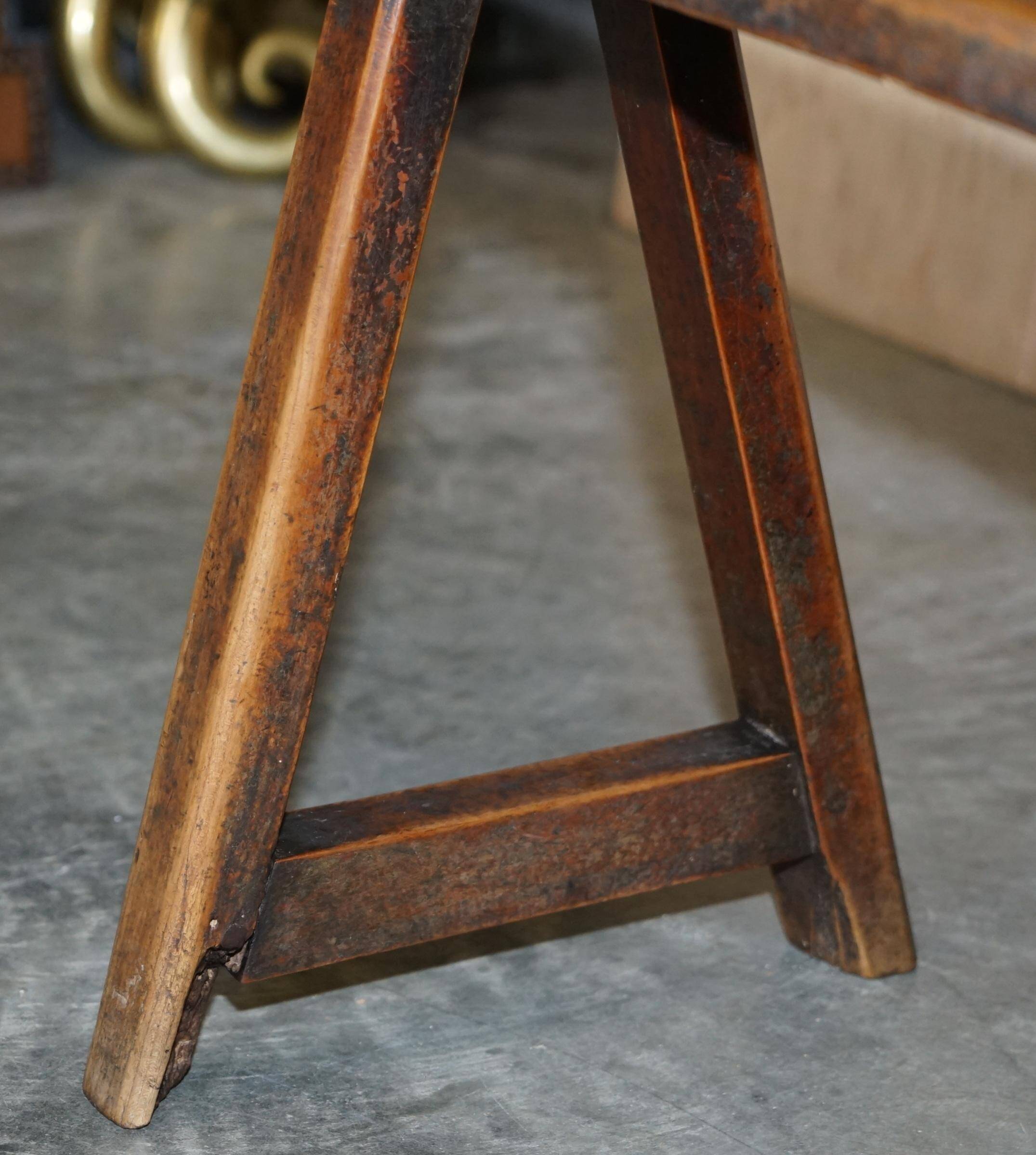 Pair of antique Victorian trestle benches in fruitwood.