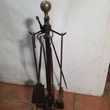 Antique fireplace set in solid wrought iron and brass.