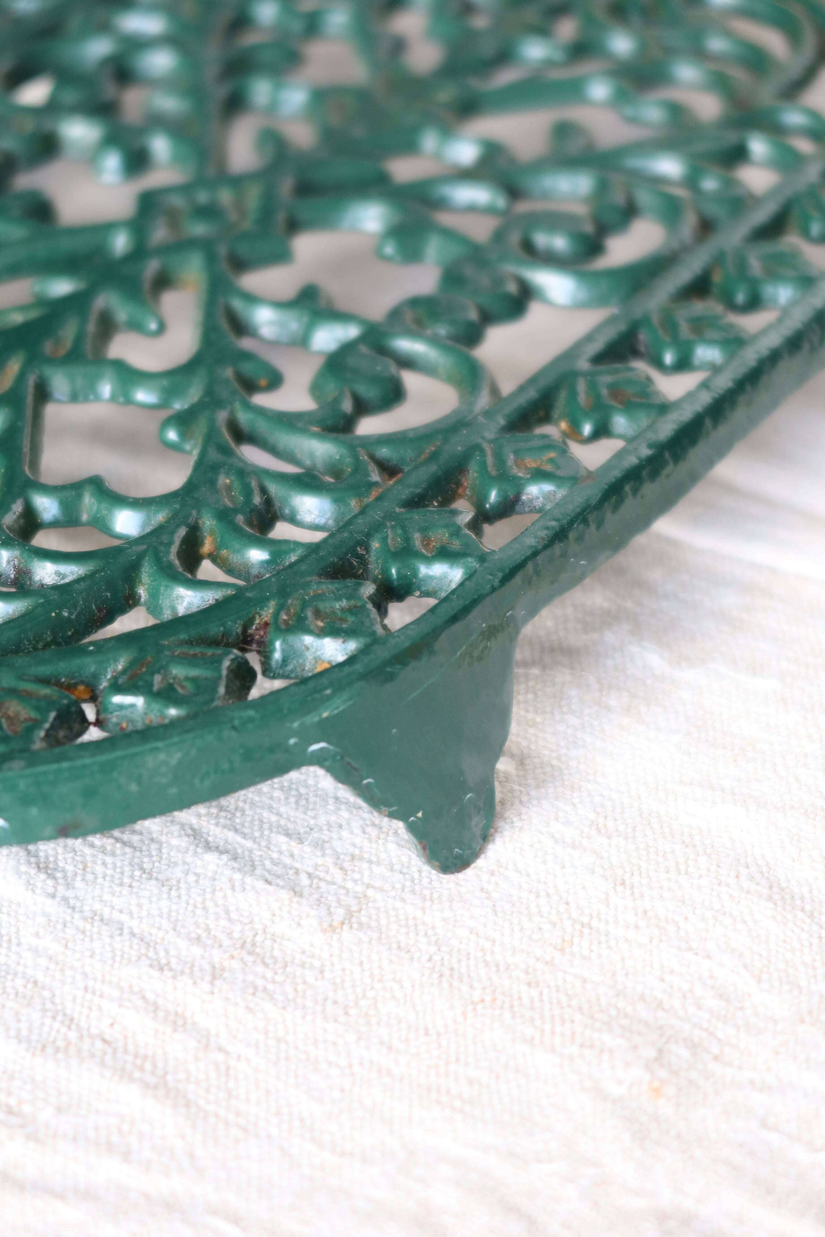 Vintage dark green cast iron oval trivet - Openwork design