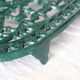 Vintage dark green cast iron oval trivet - Openwork design