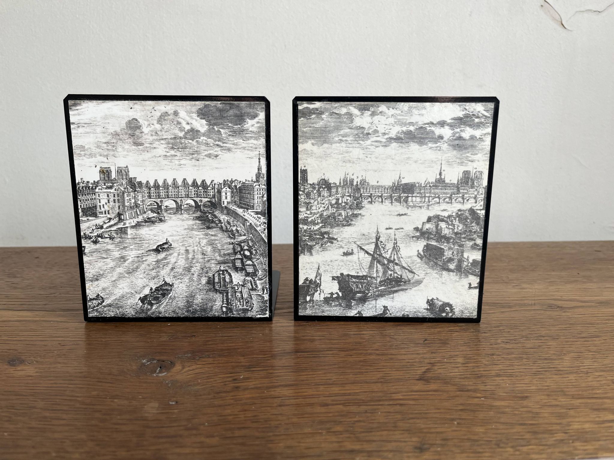 Bookends 1960 between Fornasetti's grey and Toile de Jouy views of Paris.