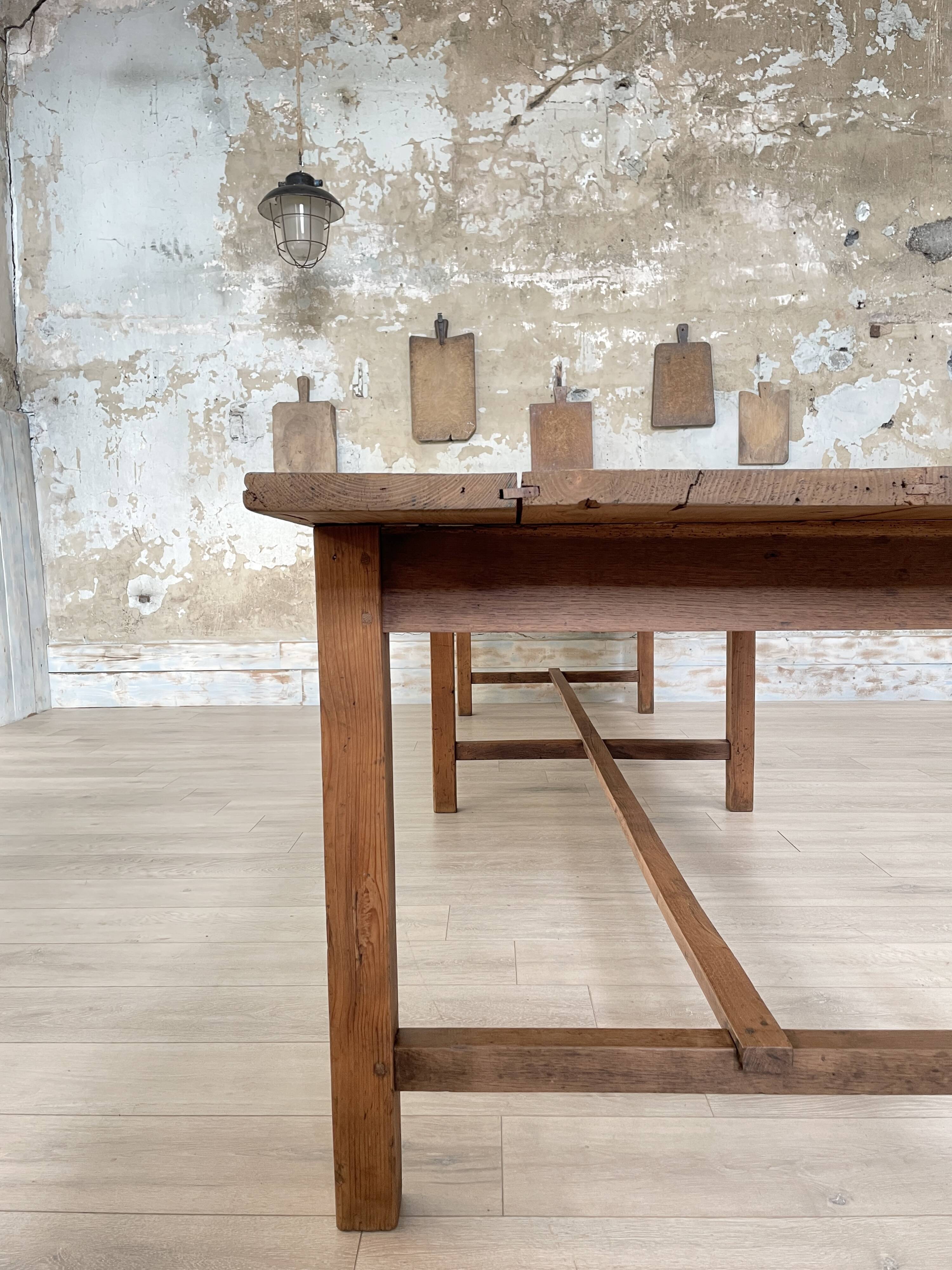 Solid wood workshop table with straight legs.