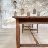 Solid wood workshop table with straight legs.