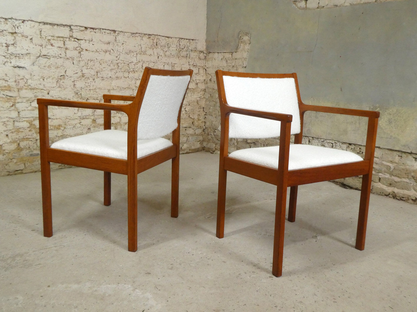 pair of Scandinavian teak armchairs and white buckles