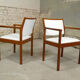 pair of Scandinavian teak armchairs and white buckles