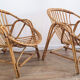 Duo de fauteuils coquille en rotin 1970