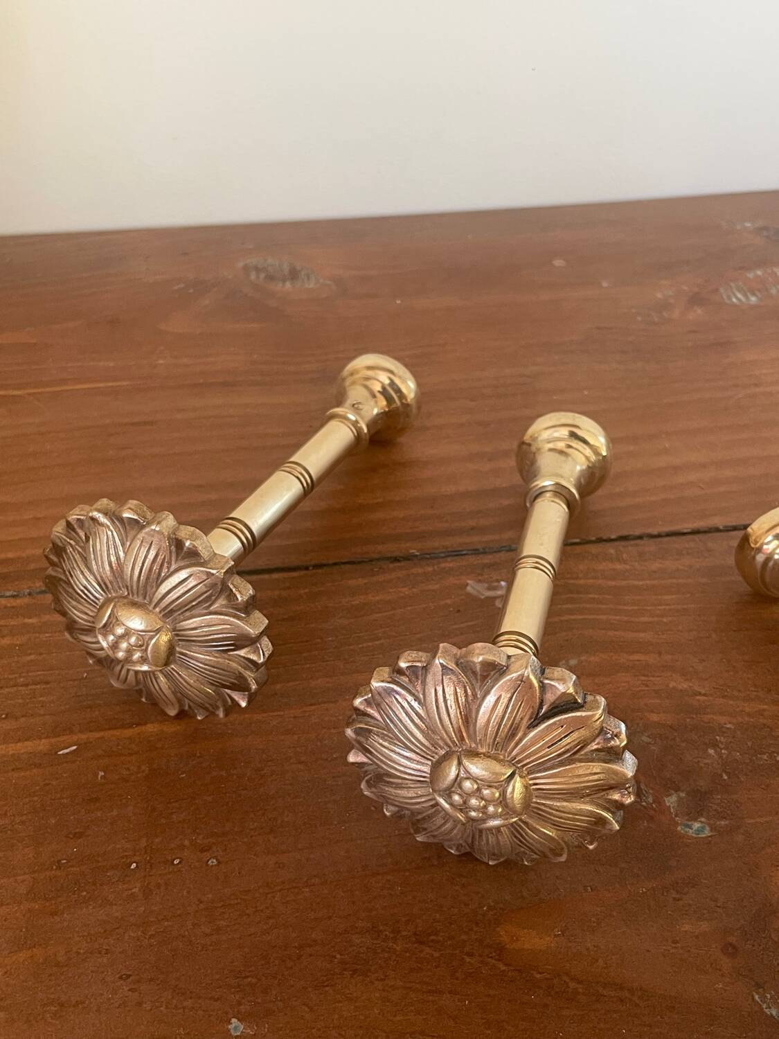 2 golden brass hooks with flower curtain tiebacks