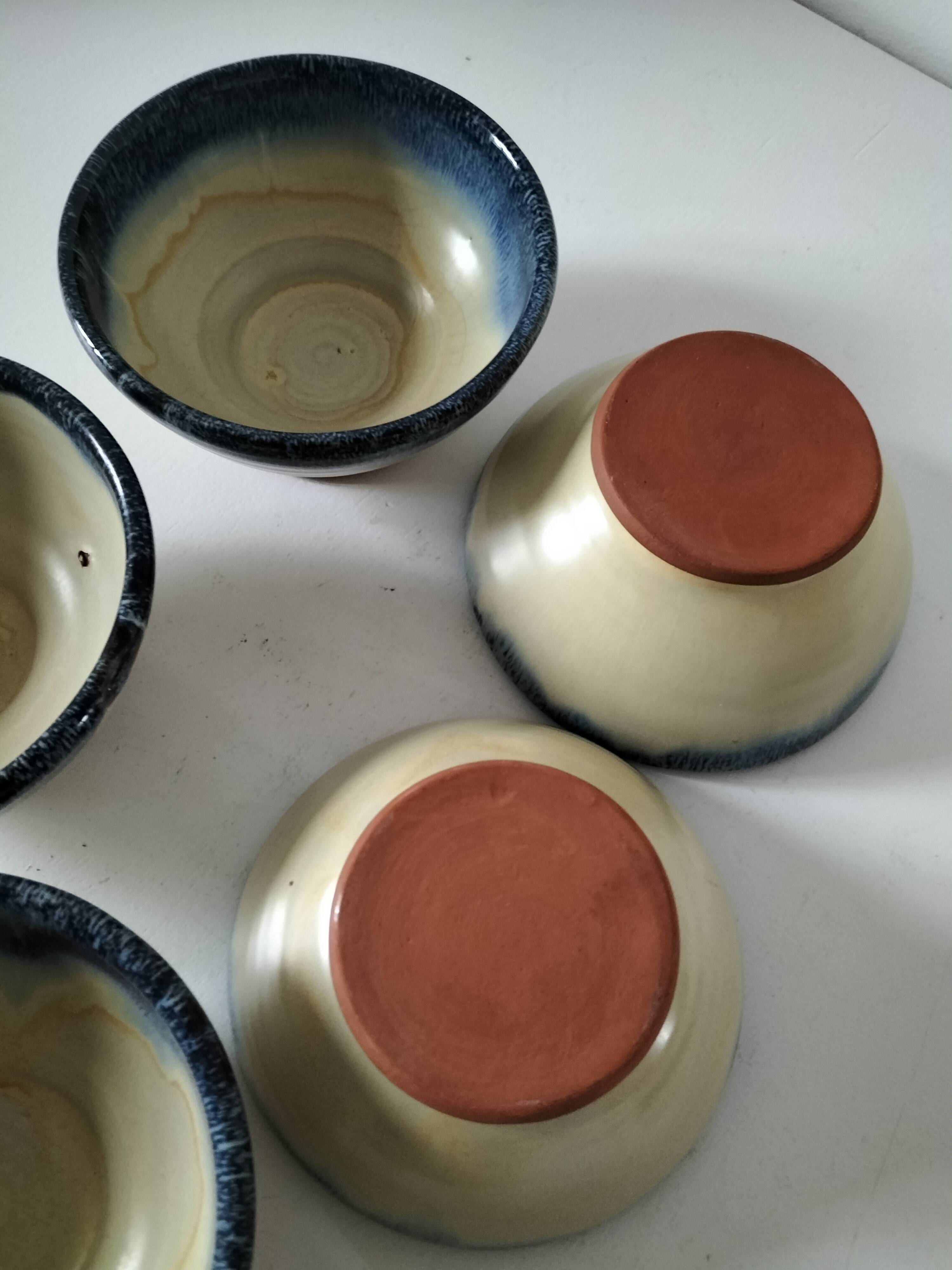 Set of 5 small blue and cream glazed stoneware bowls