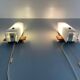 Mid-century wall lights in white plexiglass with a wooden base, 1960s, Germany.