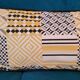 Coussins graphiques passepoil cuir