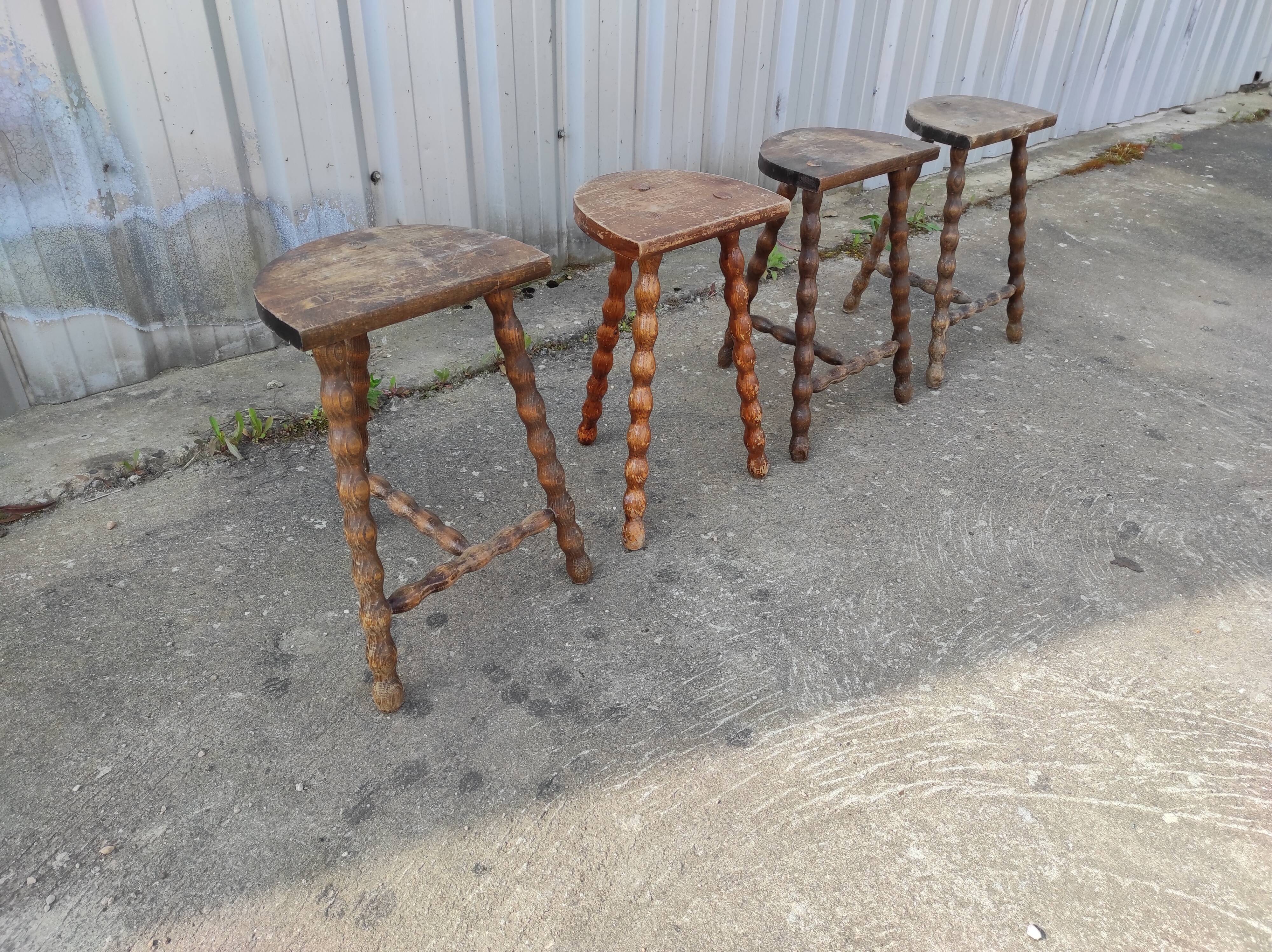 Lot 4 twisted wood tripod stools
