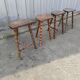 Lot 4 twisted wood tripod stools