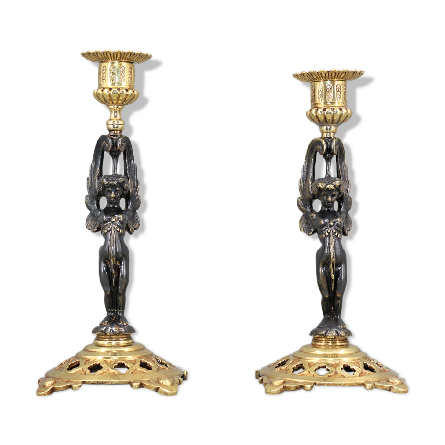 Pair of candle holders in gilded bronze and patinated with a candle