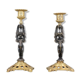 Pair of candle holders in gilded bronze and patinated with a candle