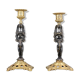 Pair of candle holders in gilded bronze and patinated with a candle