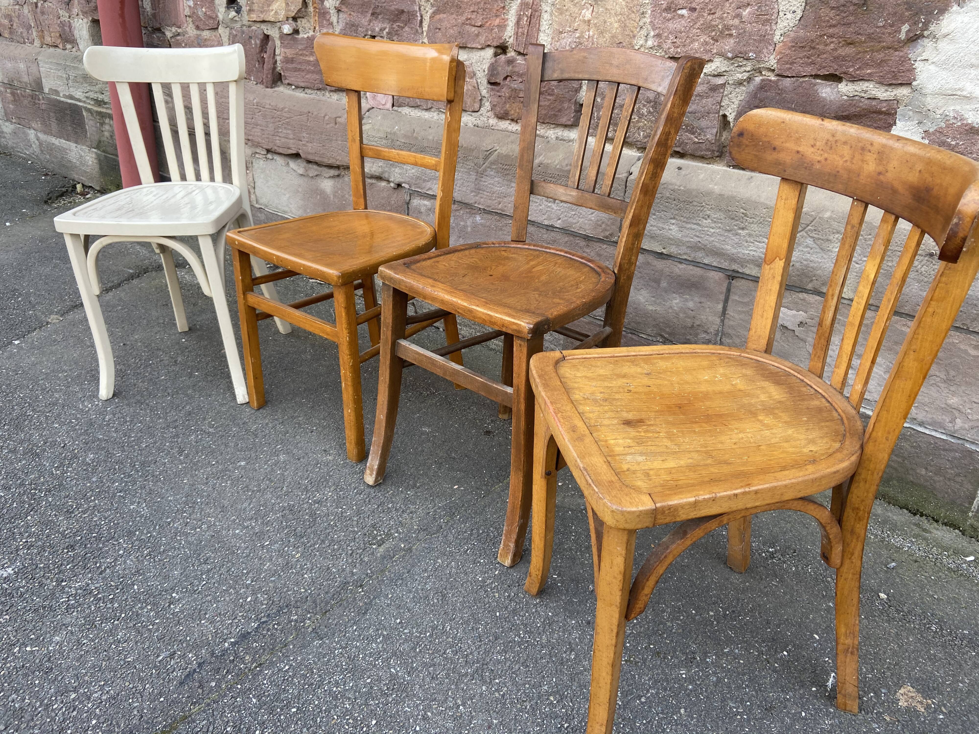 4 mismatched curved wooden bistro chairs