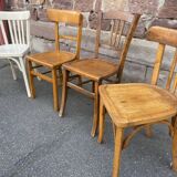 4 mismatched curved wooden bistro chairs