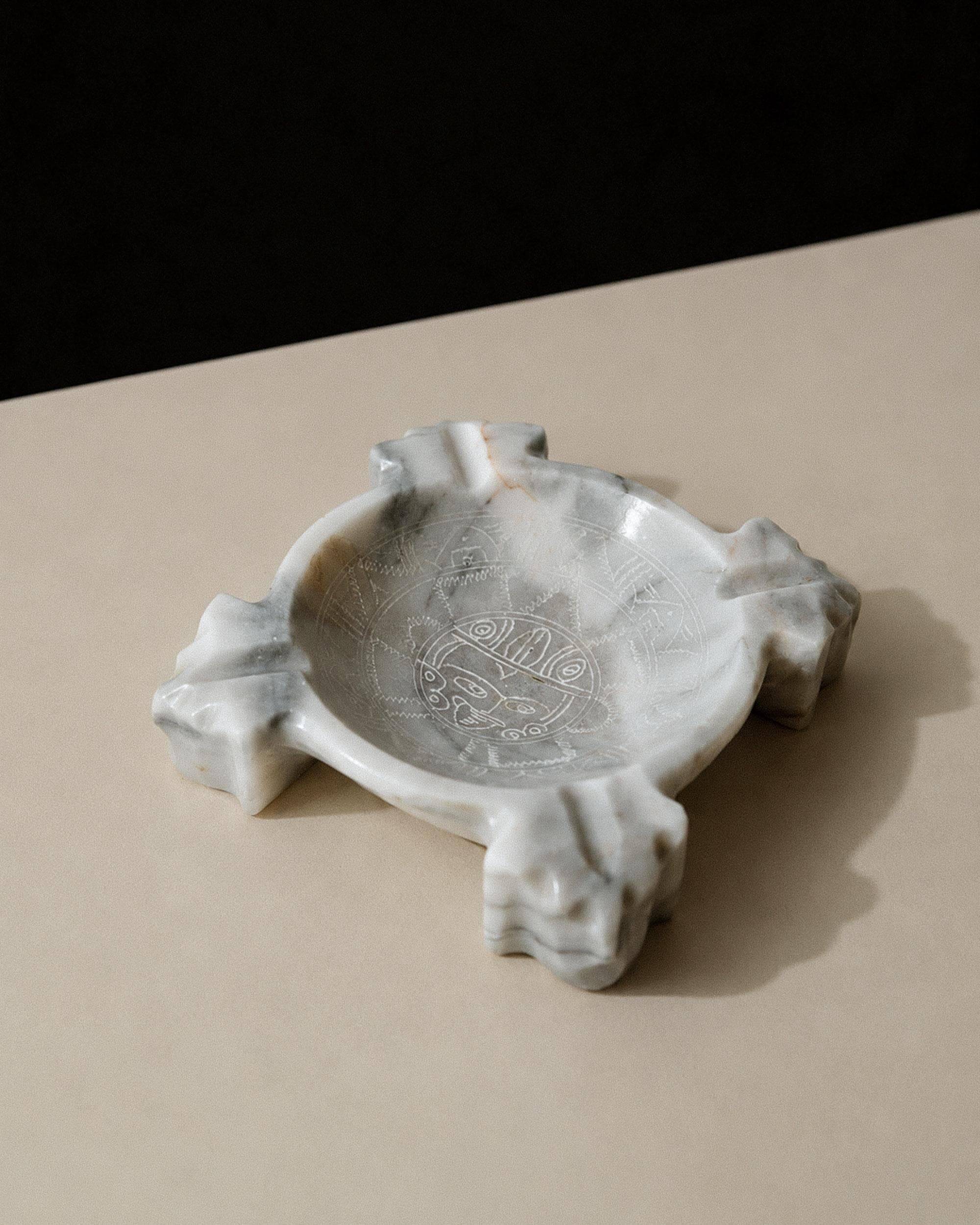 Vintage Mexican marble ashtray from the 1970s, engraved Aztec pattern.