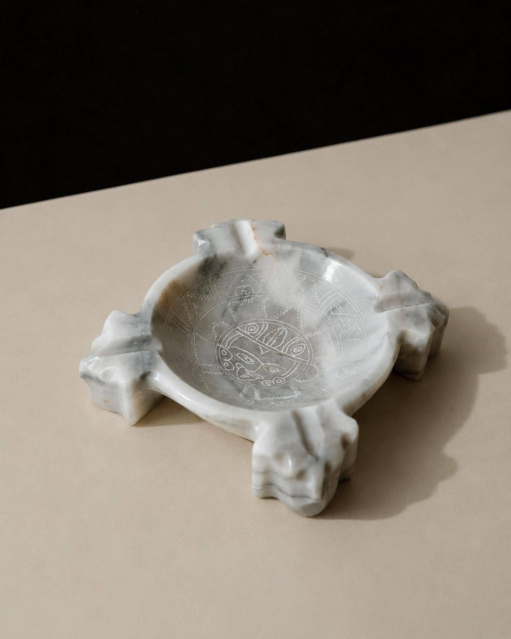 Vintage Mexican marble ashtray from the 1970s, engraved Aztec pattern.