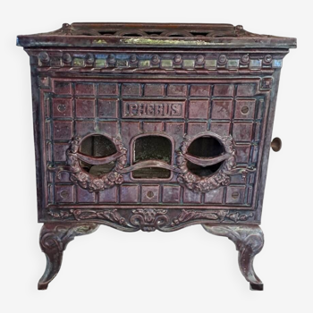 Old art deco enameled cast iron wood stove, phebus brand, eggplant color