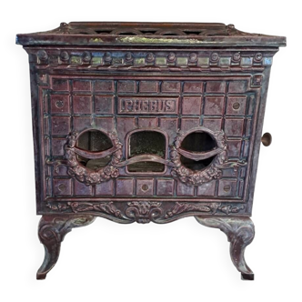 Old art deco enameled cast iron wood stove, phebus brand, eggplant color